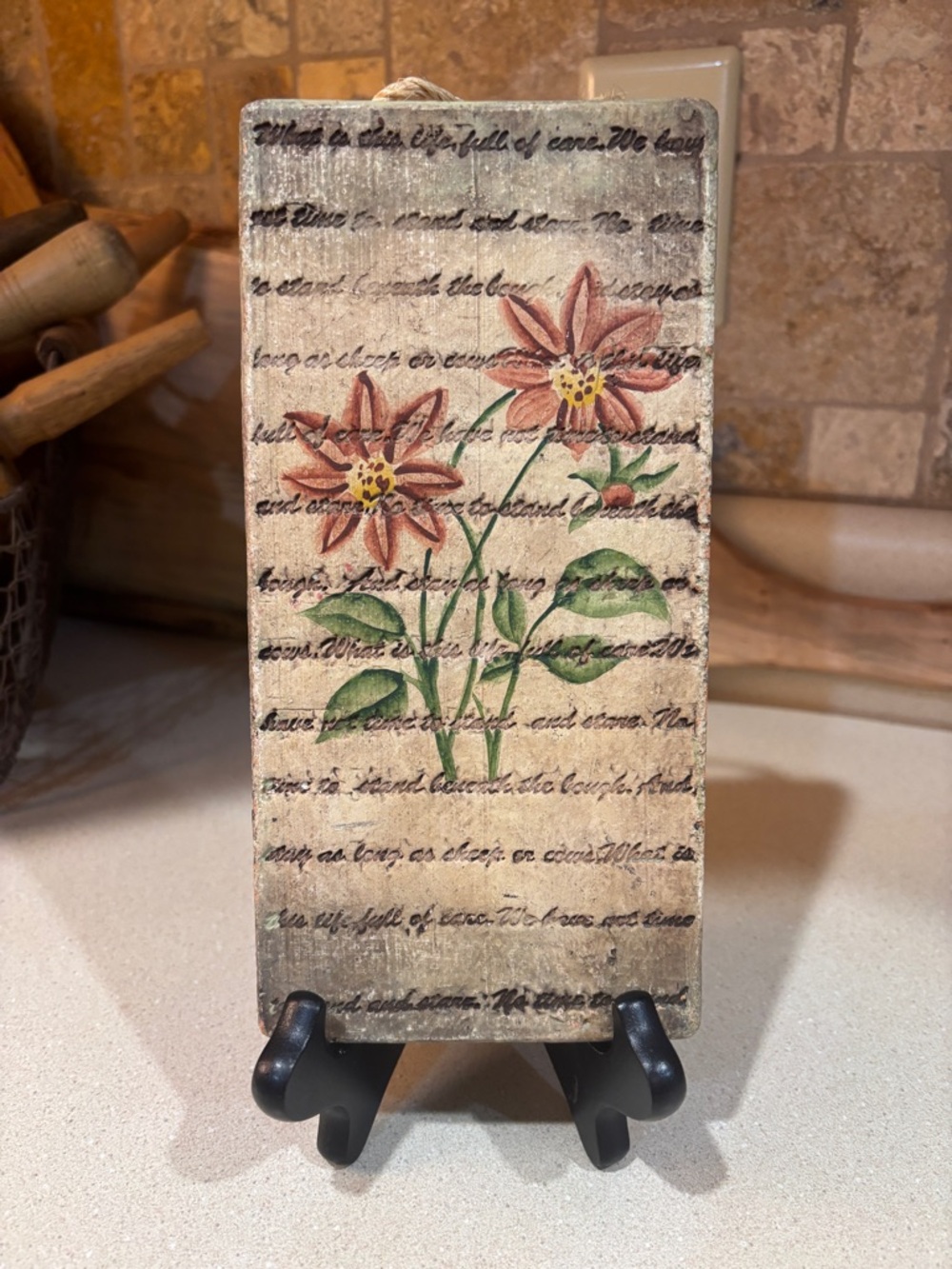 Vintage floral decorative plaque with scripted background